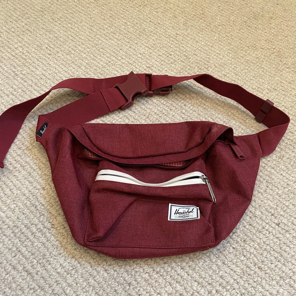 Maroon fanny pack by Hershel Supply.